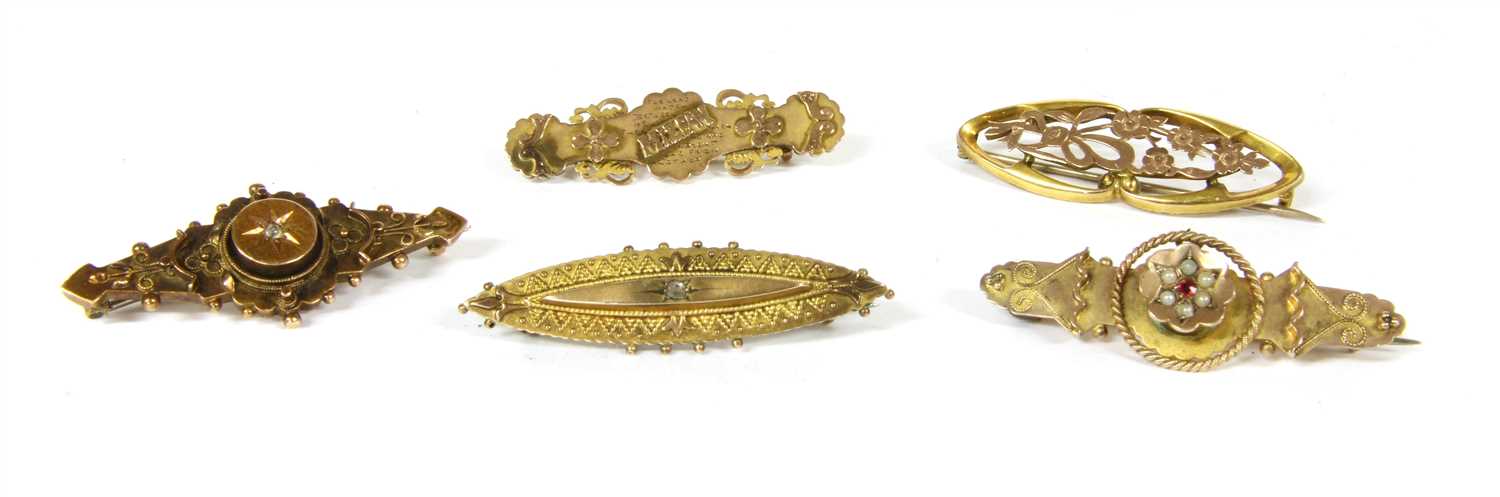 Lot 57 - Five gold bar brooches
