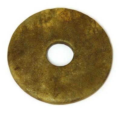 Lot 410 - A Chinese jade bi disc
