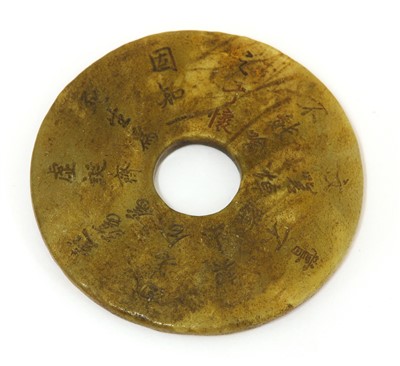 Lot 410 - A Chinese jade bi disc