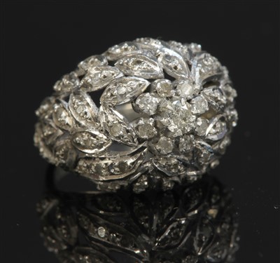 Lot 253 - A white gold diamond bombé ring
