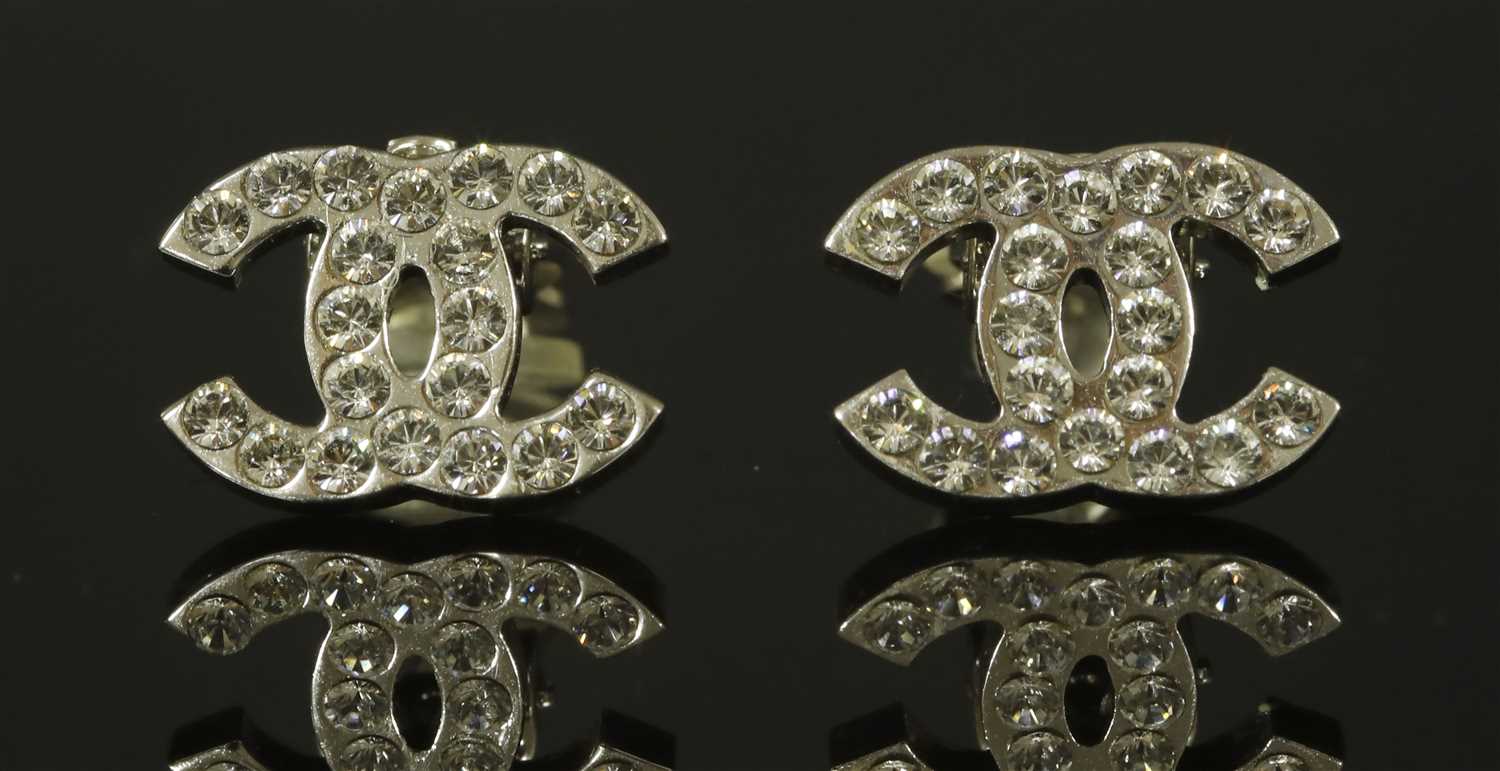 Lot 666 - A pair of Chanel double 'C' clip-on earrings