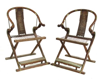 Lot 739 - A pair of Chinese padoukwood yoke back folding chairs