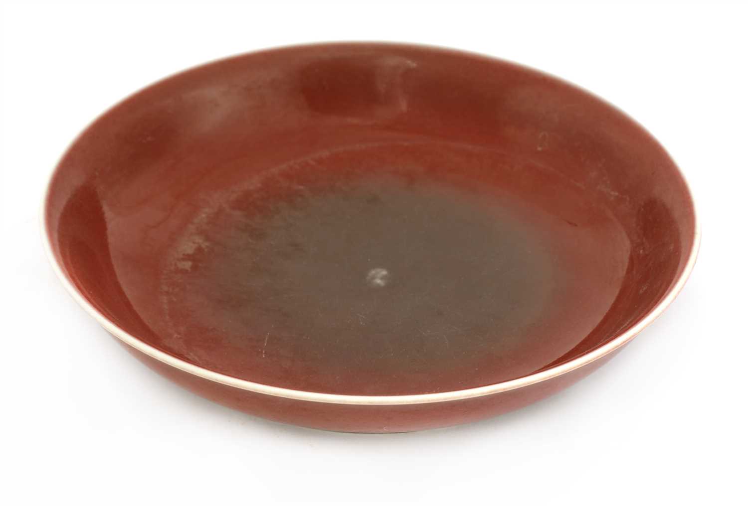 Lot 408 - A Chinese red glazed plate