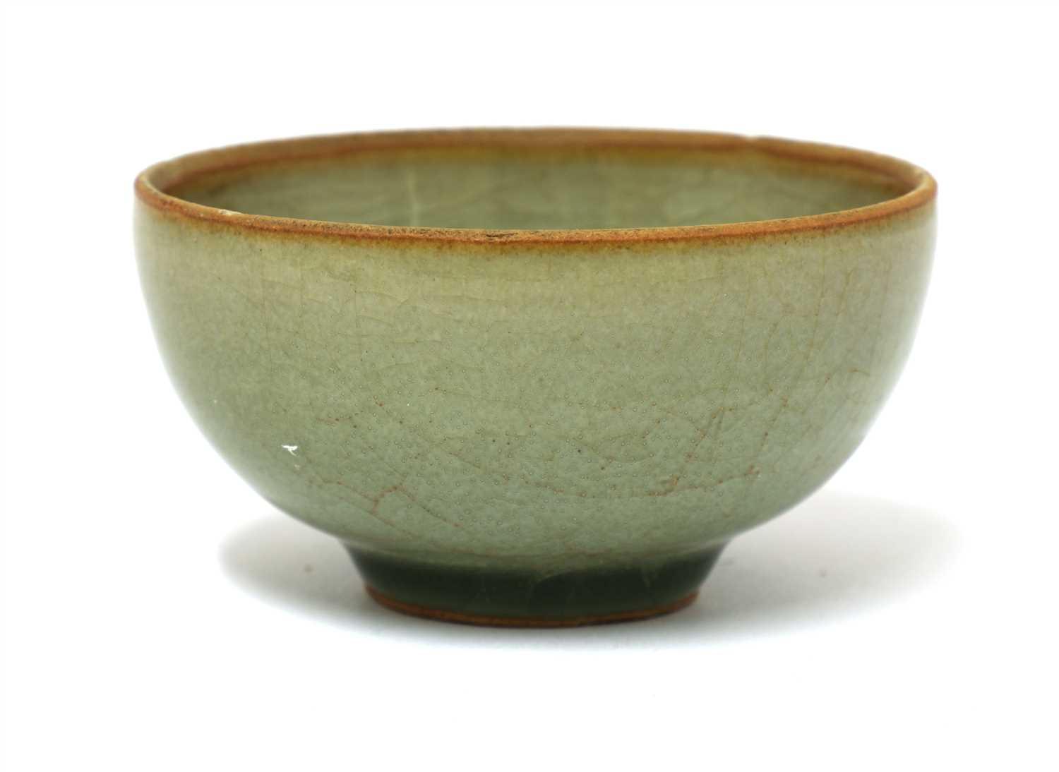 Lot 469 - A Chinese celadon tea bowl
