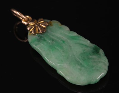 Lot 220 - A Chinese carved nephrite gourd pendant