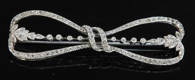 Lot 158 - A French Belle Époque diamond set bow brooch