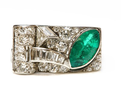 Lot 205 - An odeonesque emerald and diamond cocktail ring, c.1935-1945