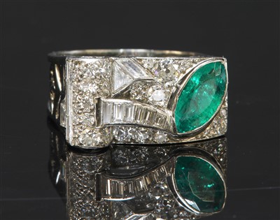 Lot 205 - An odeonesque emerald and diamond cocktail ring, c.1935-1945