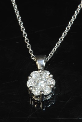 Lot 436 - A 9ct white gold diamond set cluster pendant