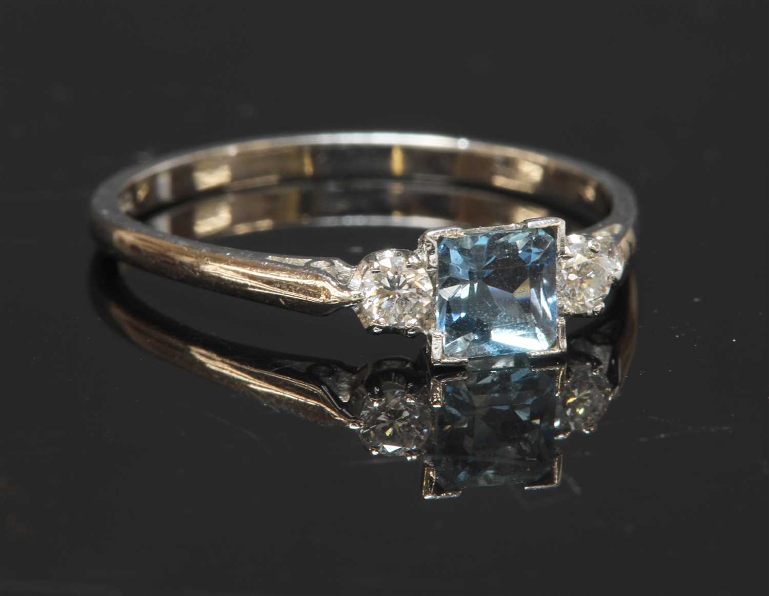 Lot 439 - A white gold three stone aquamarine and diamond ring