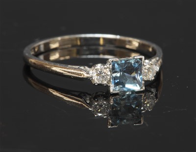 Lot 439 - A white gold three stone aquamarine and diamond ring