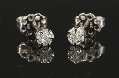 Lot 513 - A pair of white gold seven stone diamond cluster earrings