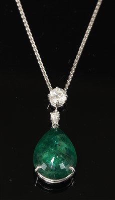 Lot 452 - An 18ct white gold emerald and diamond pendant