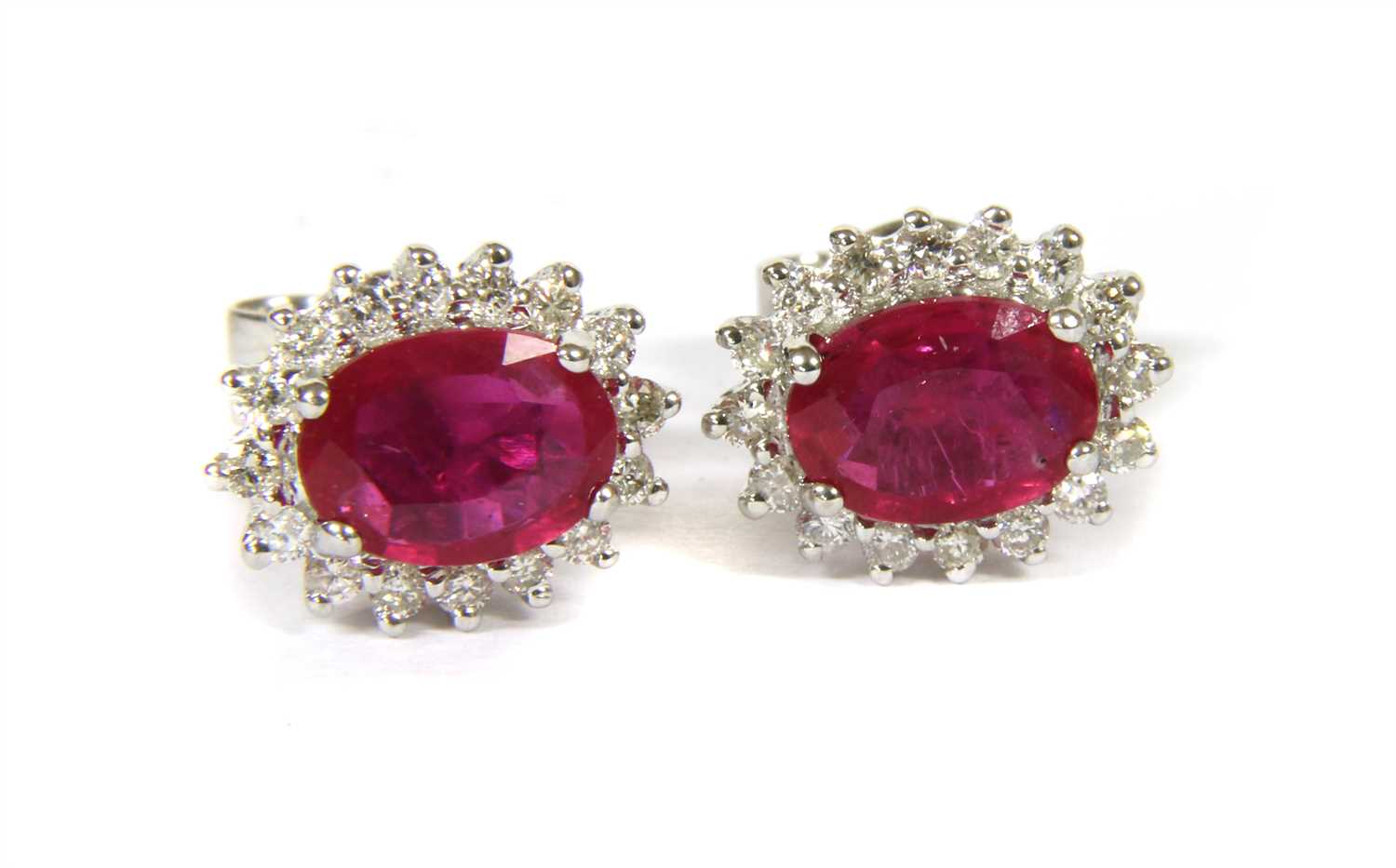 Lot 71 - A pair of white gold ruby and diamond cluster stud earrings