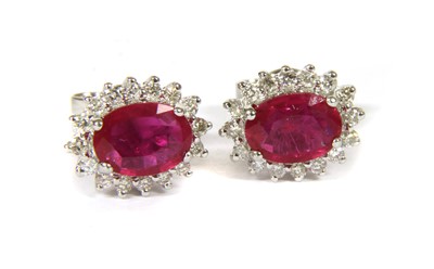 Lot 71A - A pair of white gold ruby and diamond cluster stud earrings