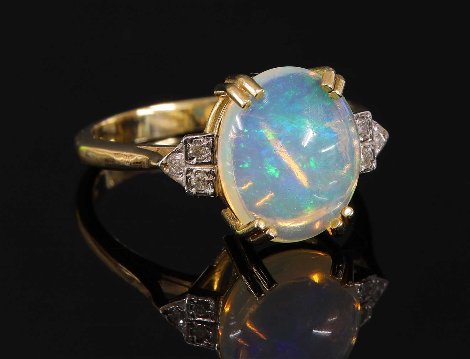 Lot 358 - An 9ct gold opal and diamond ring