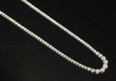 Lot 462 - A white gold diamond set graduated rivière necklace