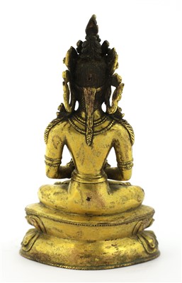 Lot 121 - A Tibetan gilt bronze bodhisattva