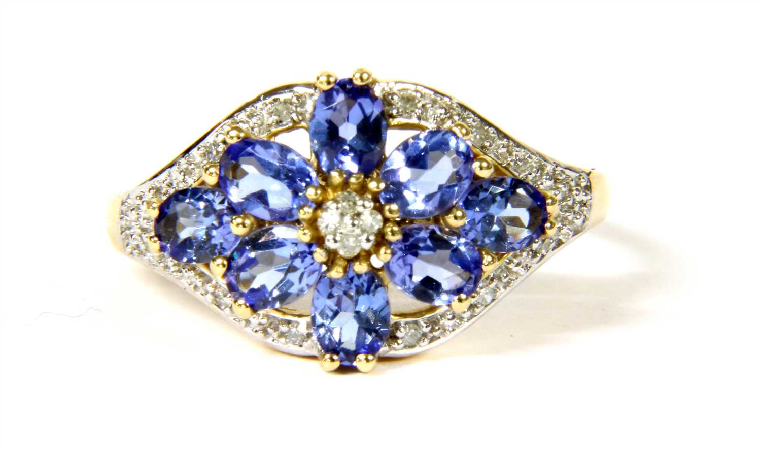 Lot 17 - A 14ct gold tanzanite and diamond floral cluster ring