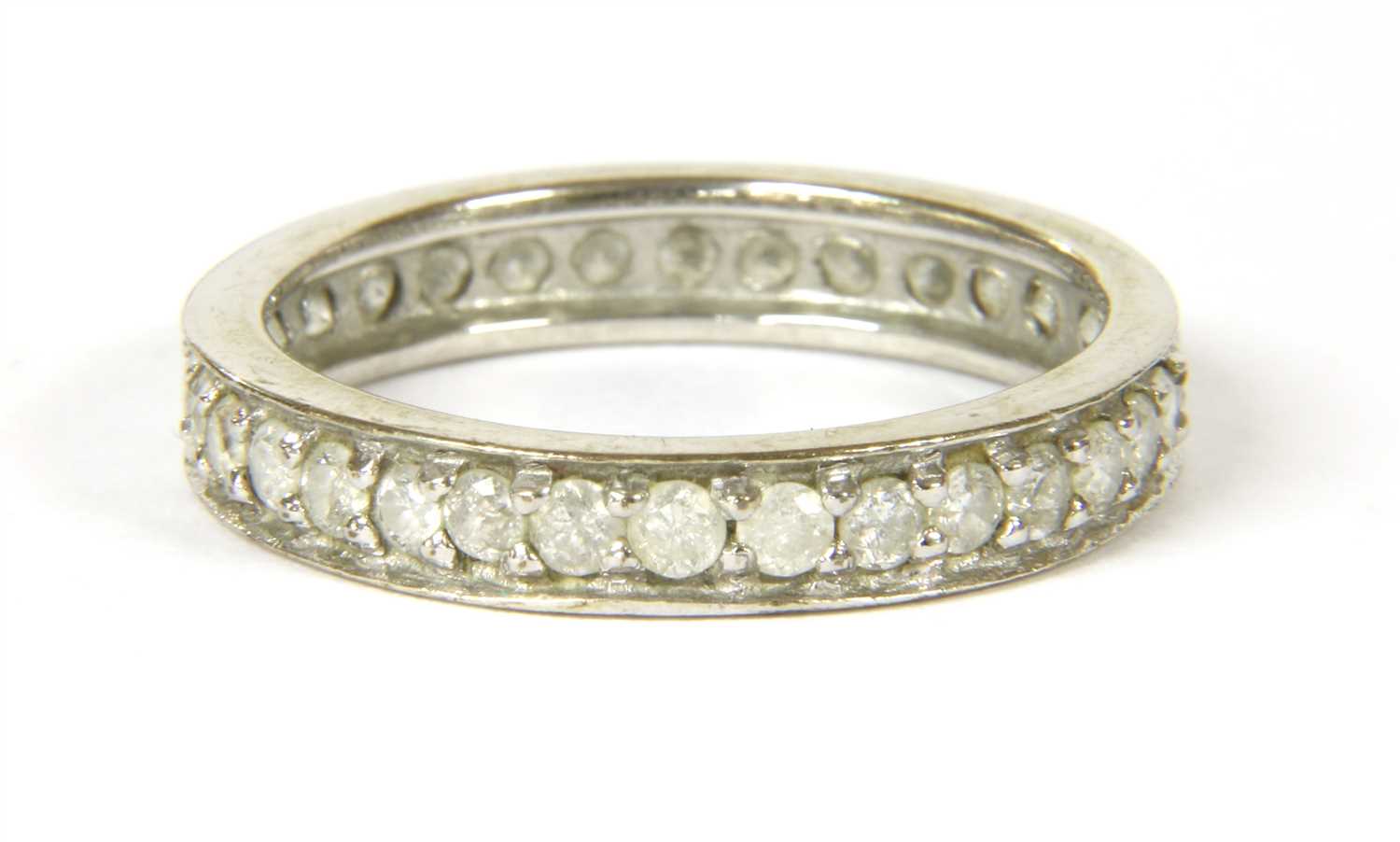 Lot 19 - A 9ct white gold diamond eternity ring
