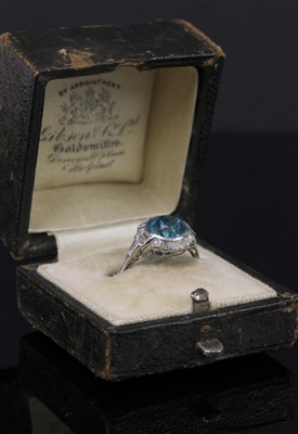 Lot 156 - An Art Deco blue zircon and diamond daisy cluster ring