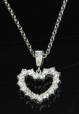 Lot 451 - An 18ct white gold diamond set heart pendant and chain