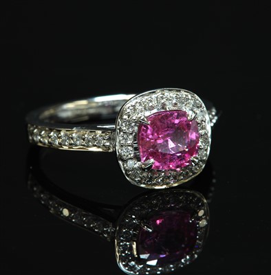 Lot 483 - An 18ct white gold pink sapphire and diamond cushion-shaped cluster ring