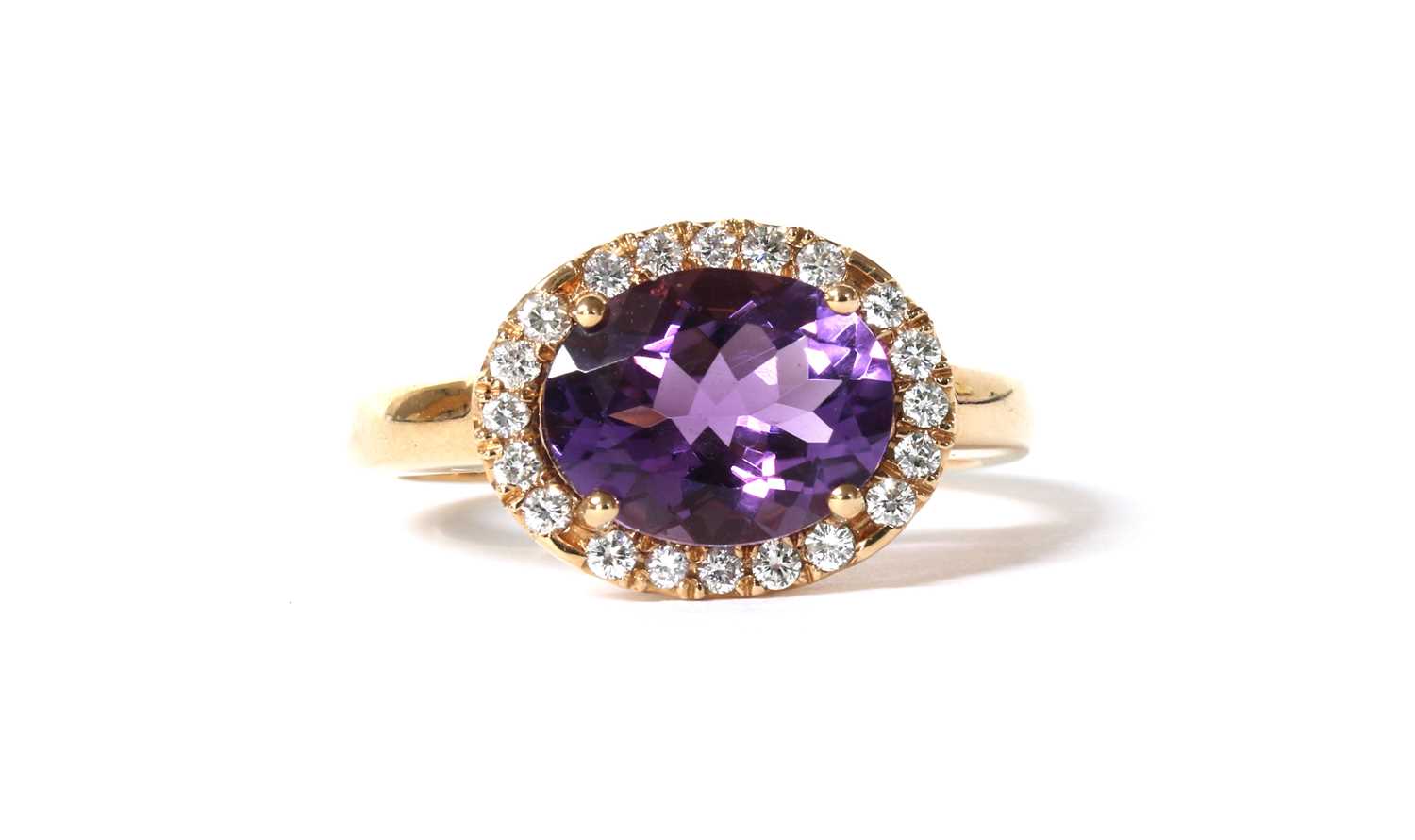 Lot 159 - An Italian rose gold amethyst and diamond halo cluster ring