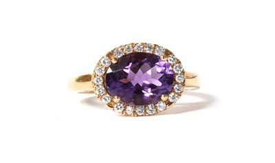 Lot 159 - An Italian rose gold amethyst and diamond halo cluster ring