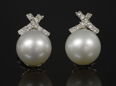 Lot 392 - A pair of Continental white gold cultured South Sea pearl and diamond earrings