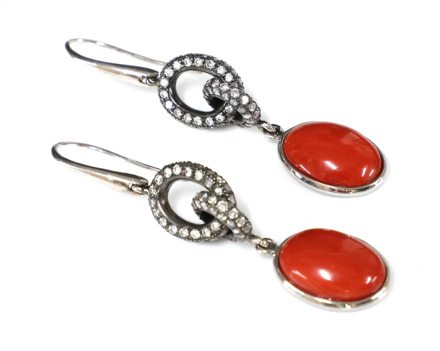 Lot 108 - A pair of Continental white gold coral and diamond drop earrings