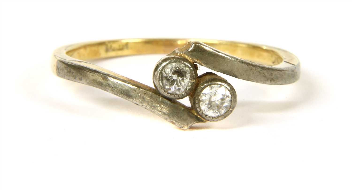 Lot 21 - A diamond two stone crossover ring