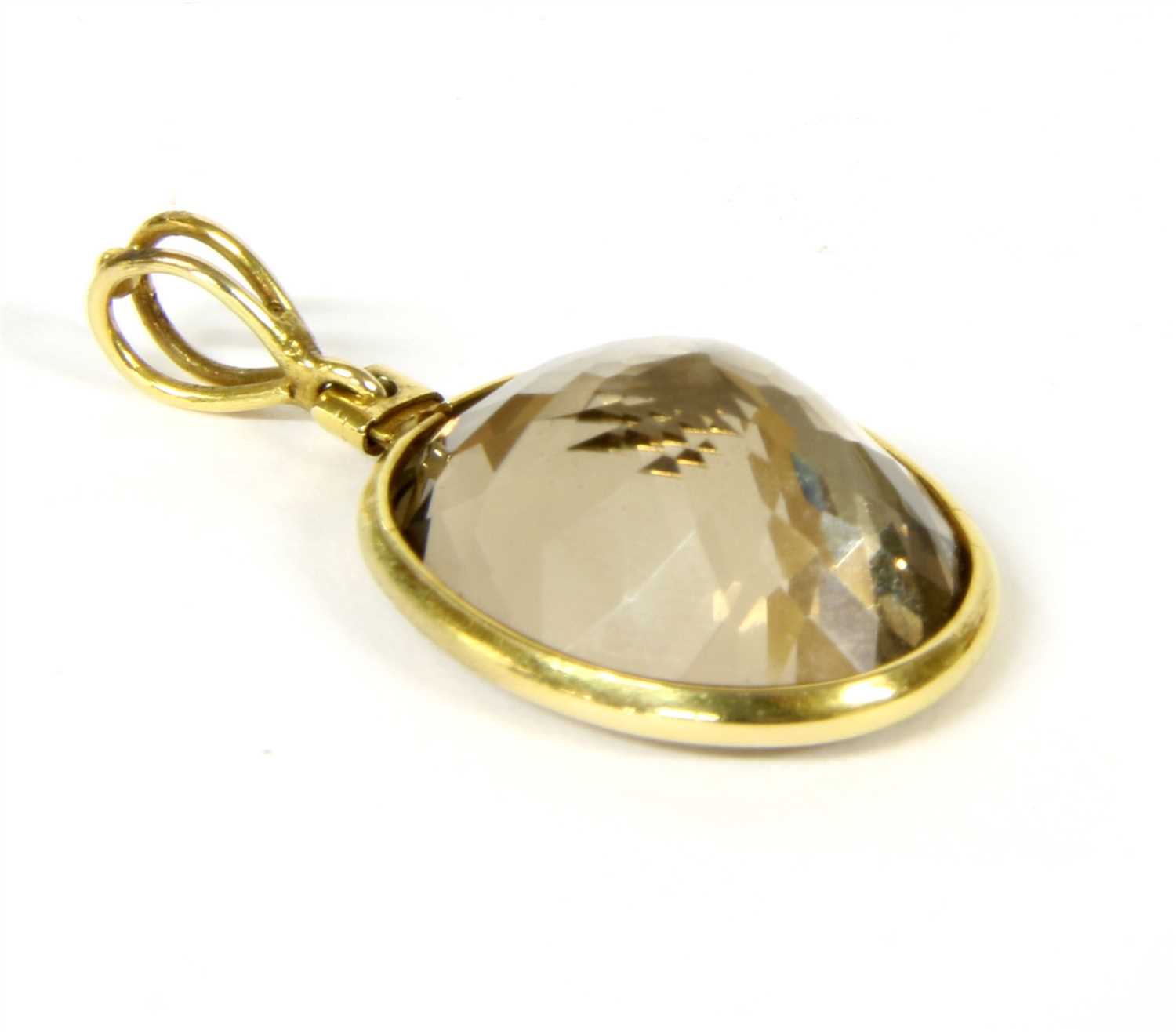 Lot 9 - A gold smokey quartz pendant