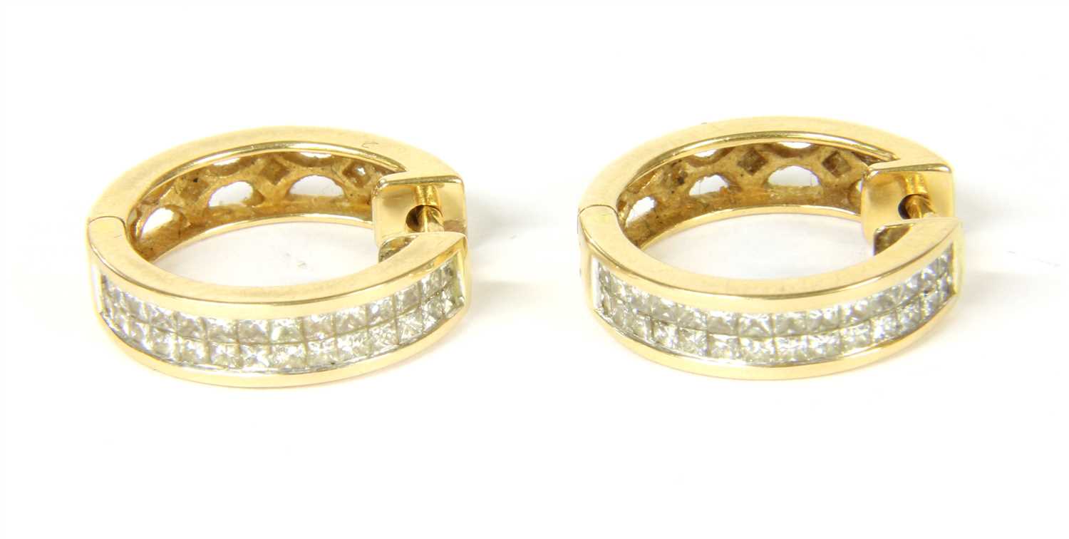 Lot 6 - A pair of diamond set hoop earrings