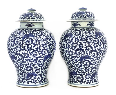 Lot 17 - A pair of Chinese blue and white vases and covers