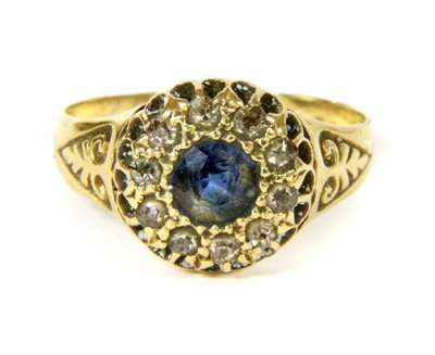 Lot 276 - A gold sapphire and diamond cluster ring