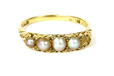 Lot 277 - A gold five stone carved head split pearl ring