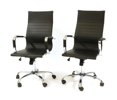 Lot 622 - A pair of Eames style chromed office chairs