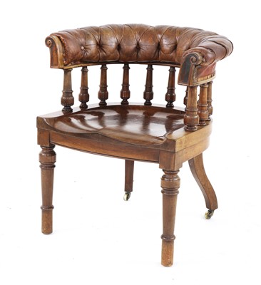 Lot 722 - A mahogany and leather upholstered desk chair