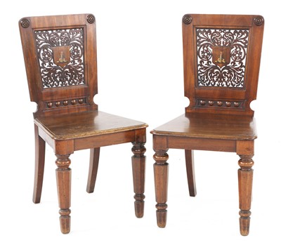 Lot 678 - A pair of mahogany hall chairs
