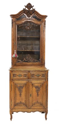 Lot 755 - A French carved oak bookcase on cupboard