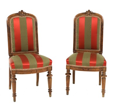 Lot 675 - A pair of French walnut side chairs