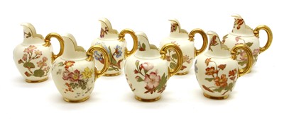Lot 267 - A group of seven Royal Worcester porcelain flat back jugs