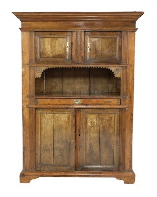 Lot 831 - A large Continental pine and walnut cupboard