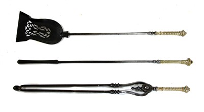 Lot 481 - A set of steel and brass fire tools