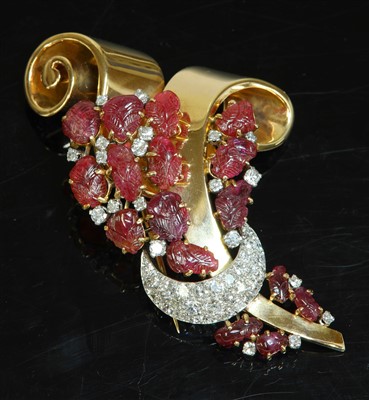 Lot 227 - A rose gold and platinum carved ruby and diamond set clip brooch, c.1940