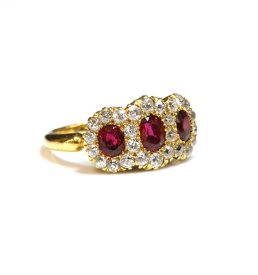 Lot 62 - An Edwardian ruby and diamond triple cluster ring, c.1900