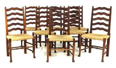 Lot 724 - A set of eight yew wood ladder back chairs