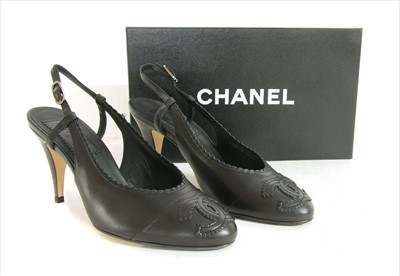Lot 1036 - A pair of Chanel sling-back black shoes