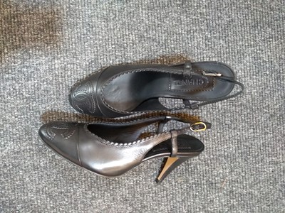Lot 1036 - A pair of Chanel sling-back black shoes